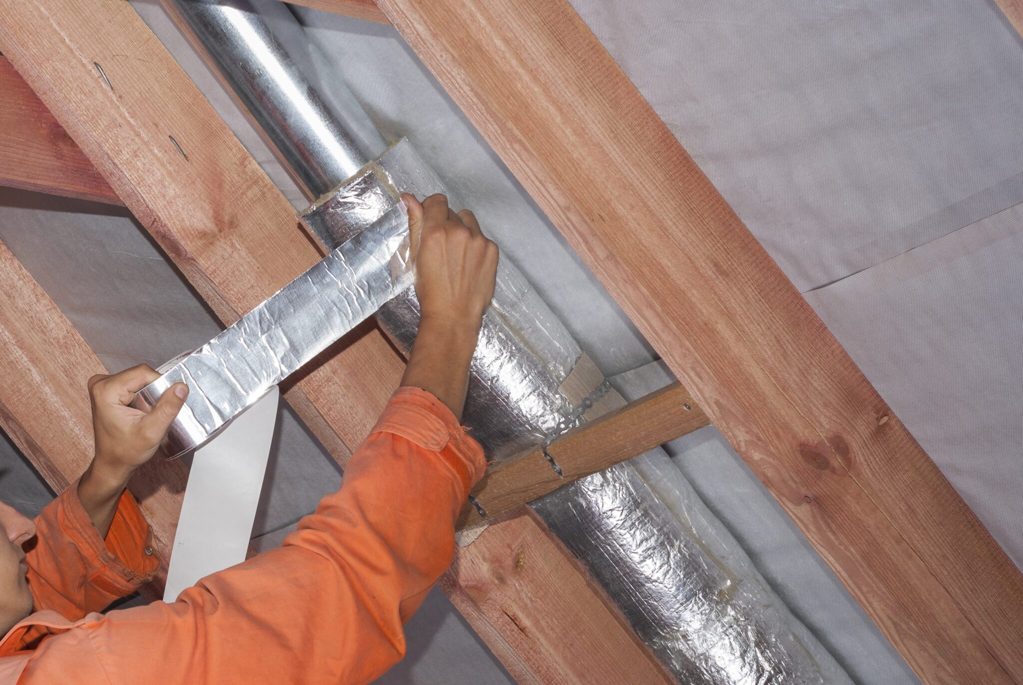 Installing Duct Insulation.