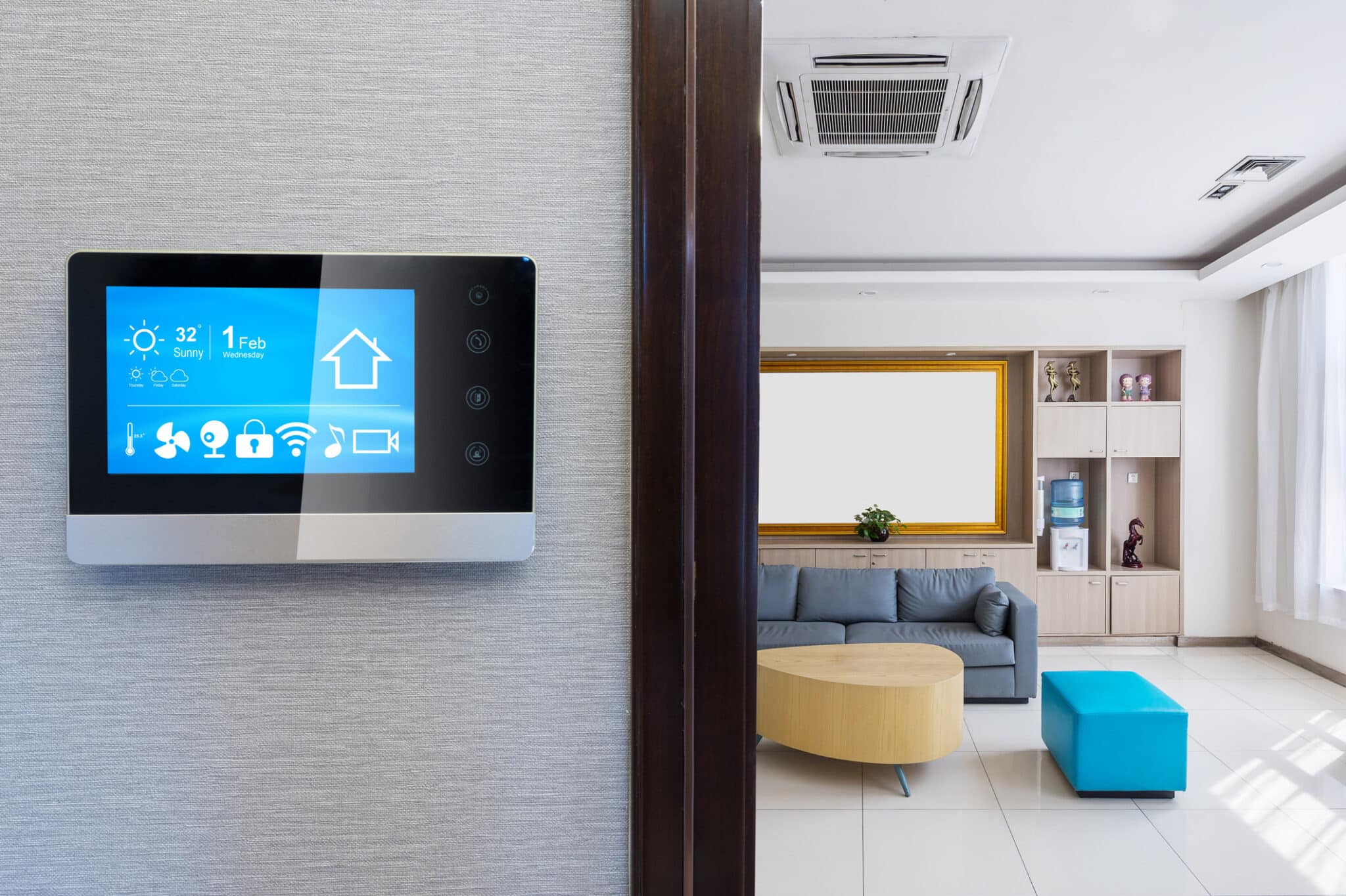 Intelligent touchscreen with a smart home app, smart vents, and a modern living room.